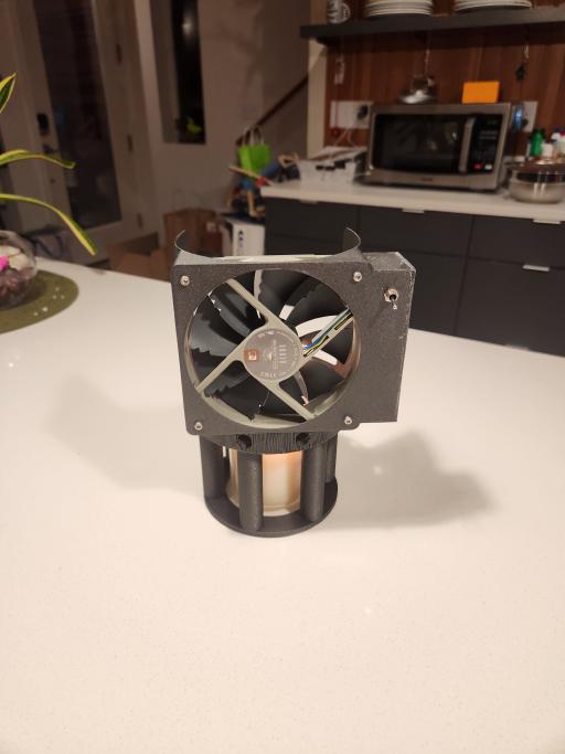 Front view of the scent sprayer: A 3d printed device for placing a fan over a scented candle.